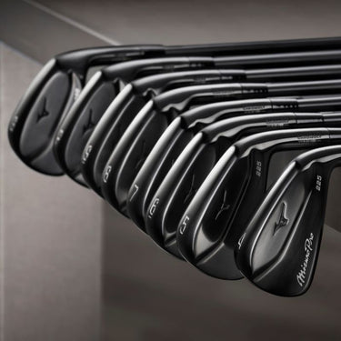 Mizuno Pro 225 Black ION Golf Iron set from a 4 Iron to a Gap Wedge lying on a black bench with a black background